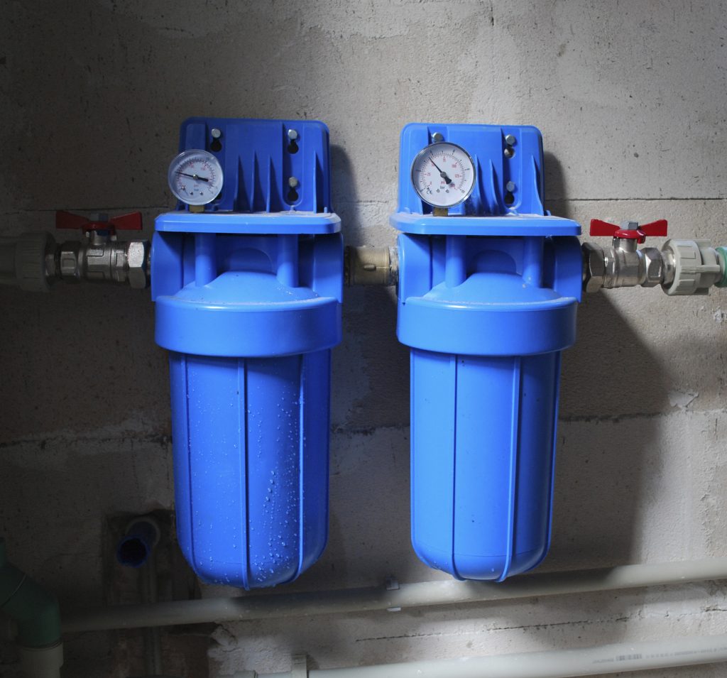 Two blue aqua filters with pressure meter. ect